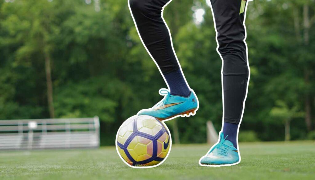 Football with foot on ball