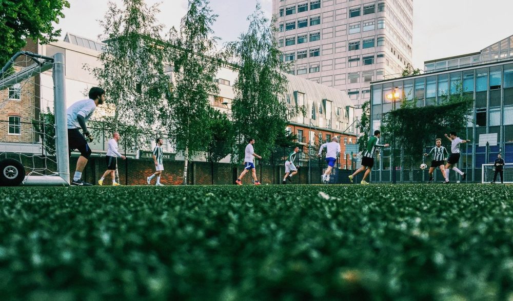 Players on the 3G 5 a side pitch at Marylebone, London NW1