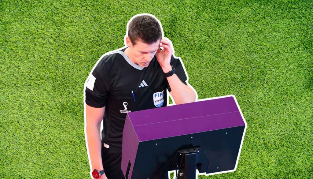 Referee checking VAR monitor