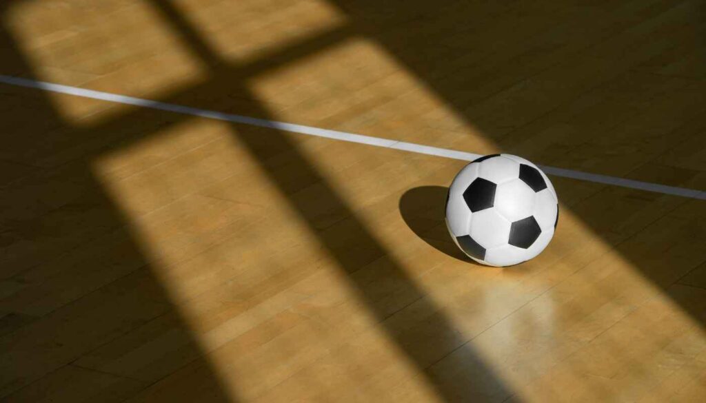 Football in sports hall.