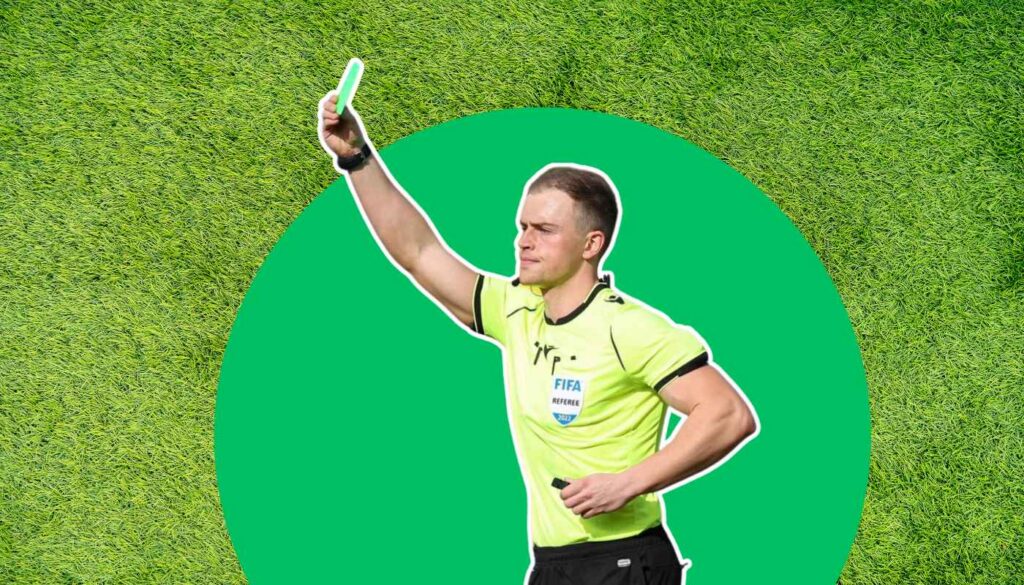 Referee giving a green card.